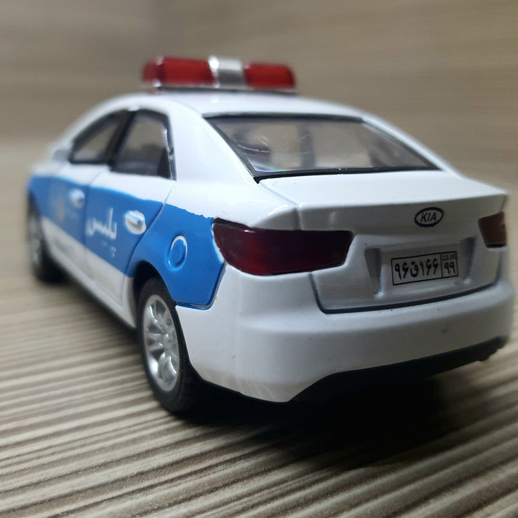 ماشین بازی فلزی مدل پلیس Cerato با درهای بازشو، صدای استارت و آژیر، چراغدار و عقبکش
